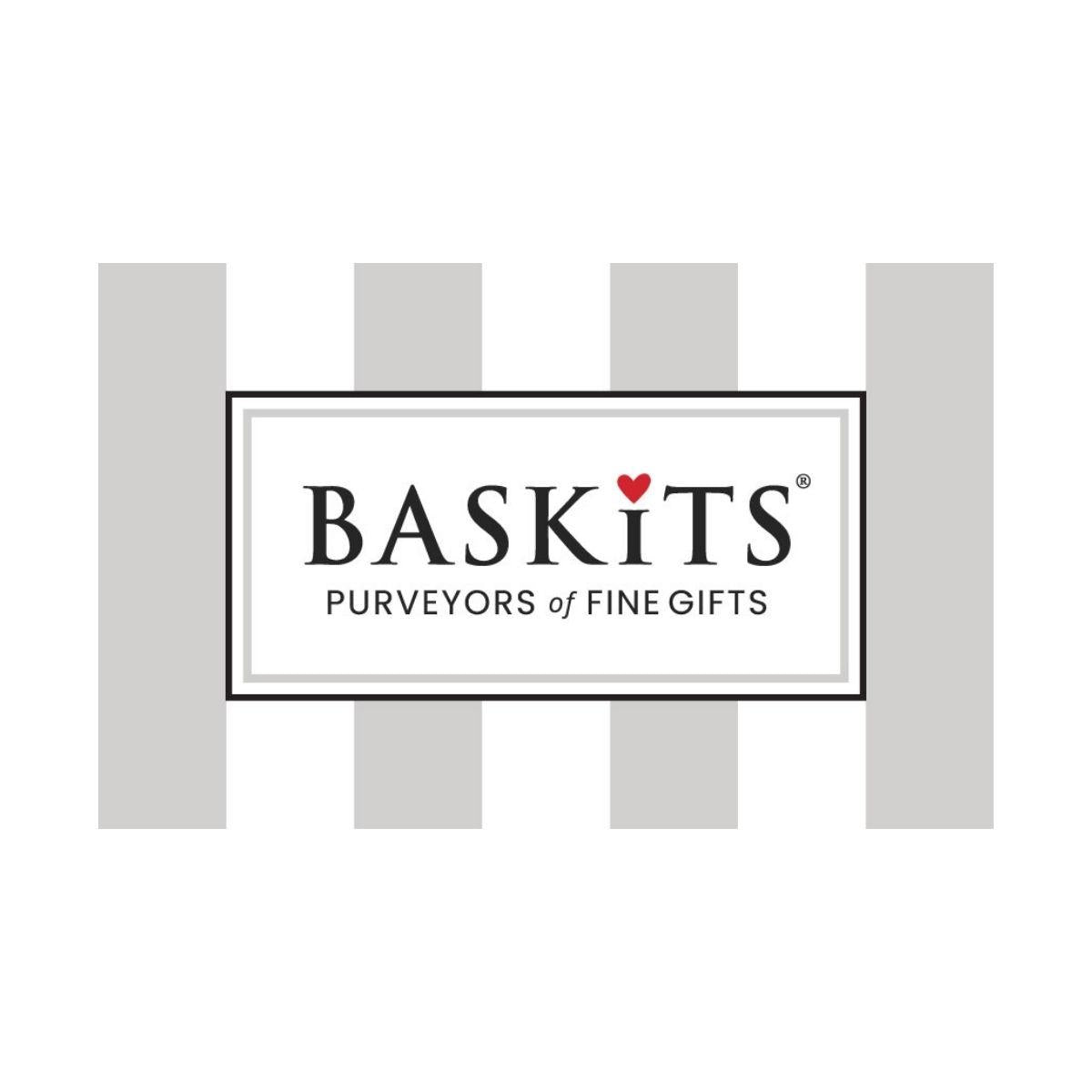 A centered rectangular logo card reading 'BASKiTS PURVEYORS OF FINE GIFTS' with a small red heart above the S, set against a white background with light gray vertical stripe shapes behind it.
